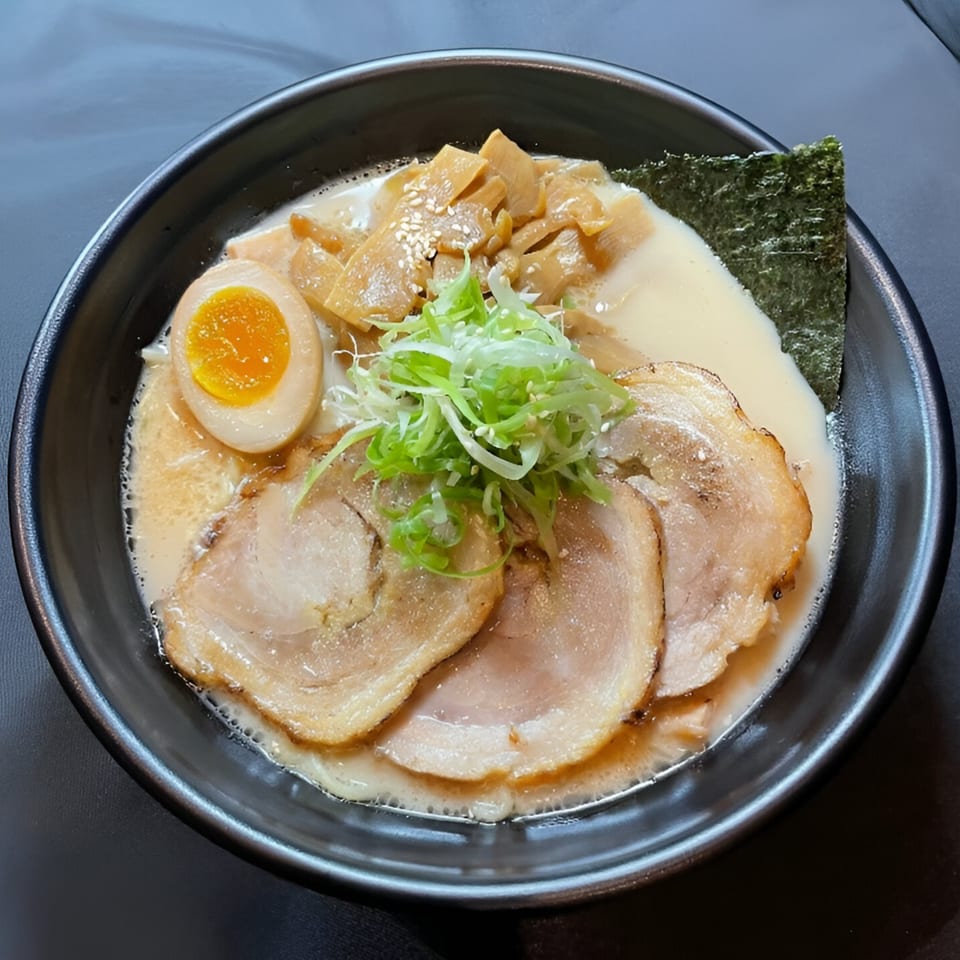 Boru Ramen's tonkotsu ramen with chashu pork, a soft-boiled egg, bamboo shoots, green onions, and nori.
